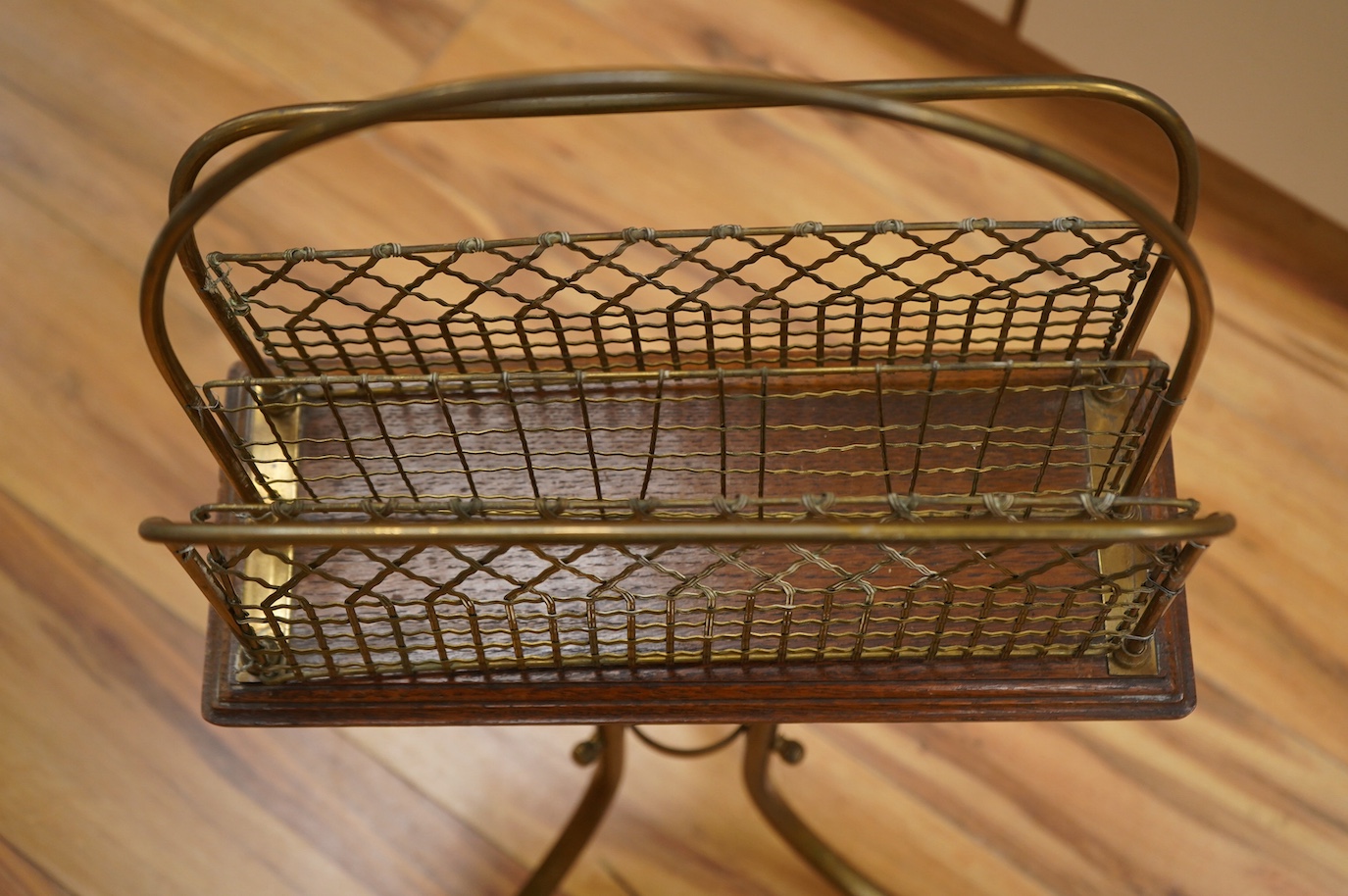 An Edwardian oak and brass Canterbury stand, 76cm. Condition - fair to good.